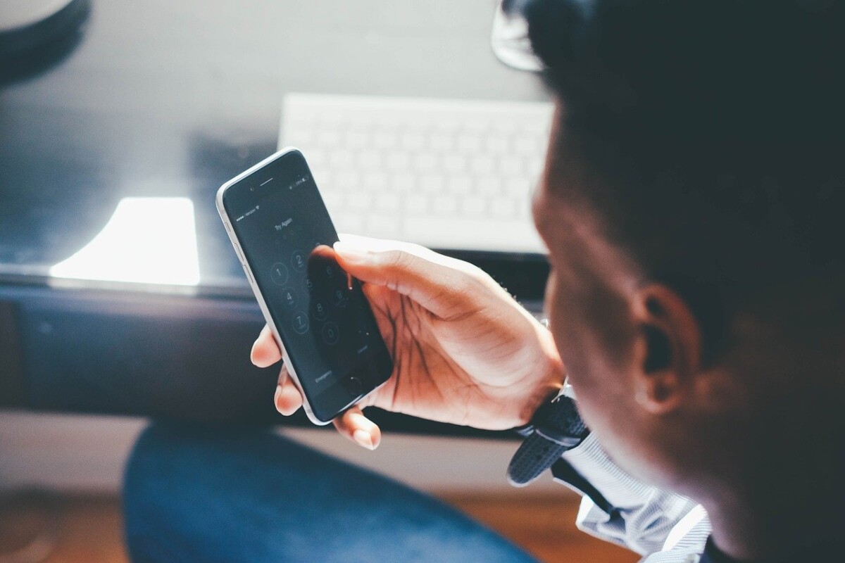 Man Looking at Iphone